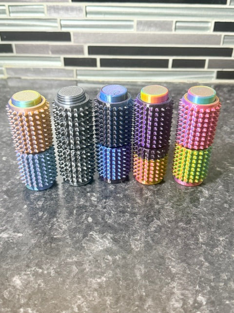 Sensory toy, clicker on one end, spikey feel, and top and bottom rotate