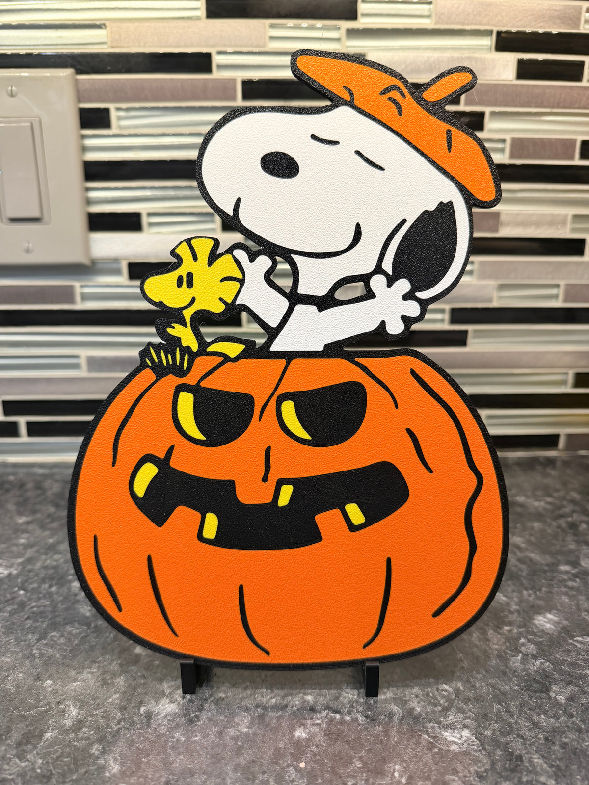 Artistic Representation of Snoopy & Woodtock in a Pumpkin Plaque